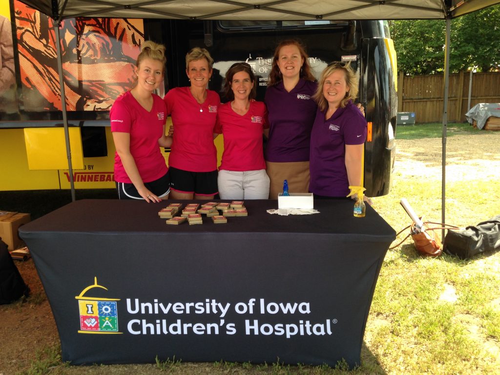 A team from UI Stead Family Children's Hospital and UI IPRC does outreach at the Iowa State Fair.