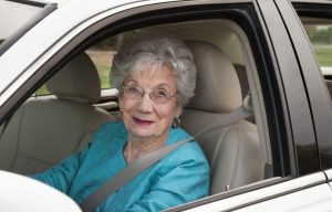 senior woman driving car