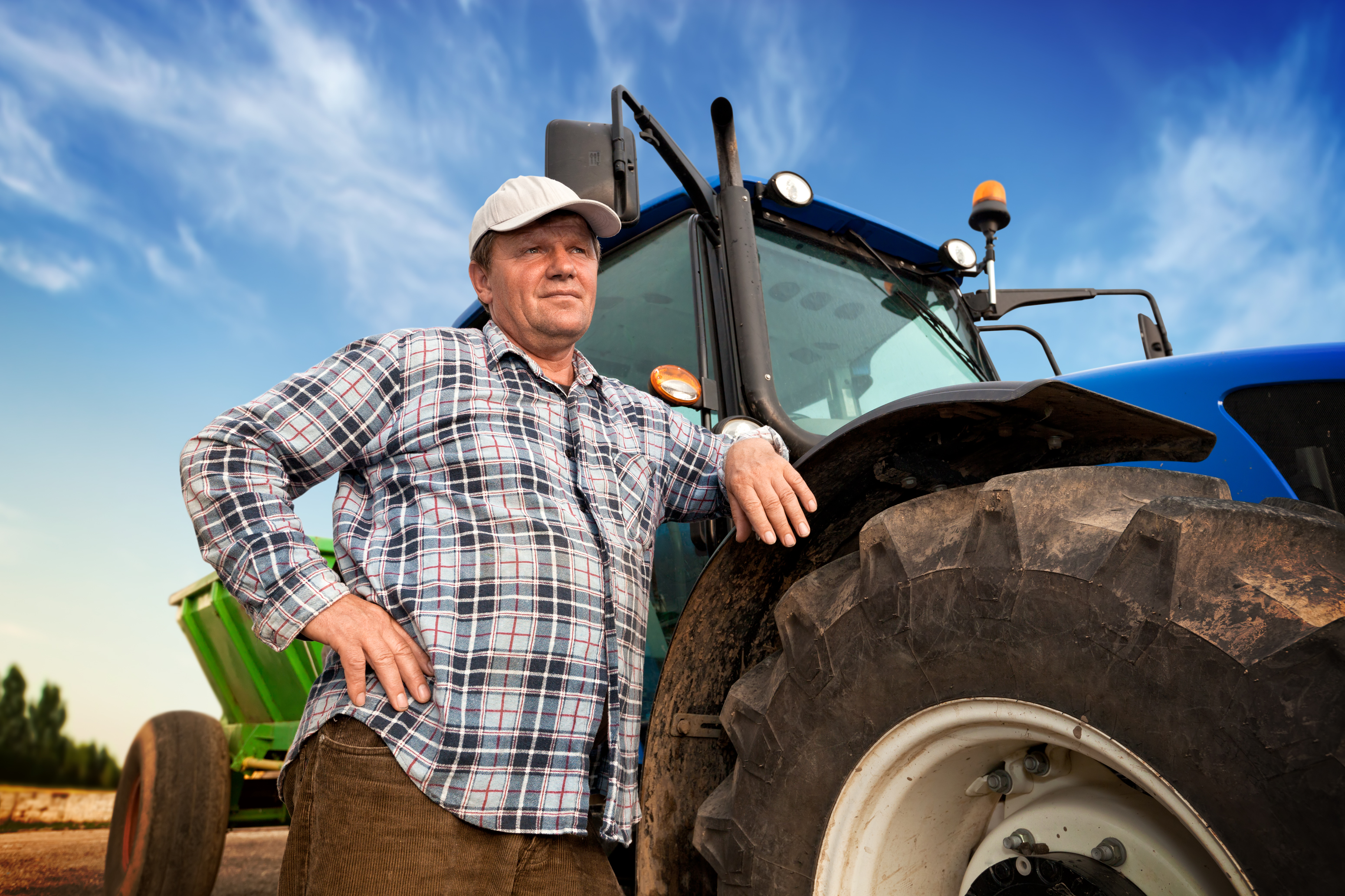 Farmer and blue tractor