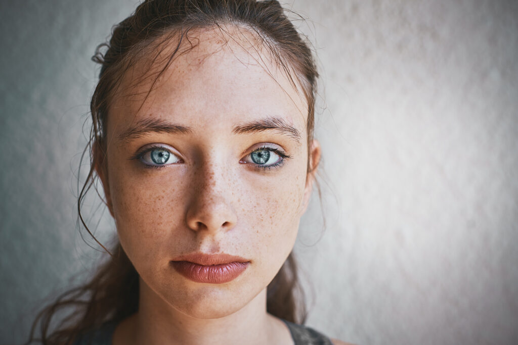 A young girl looking sad