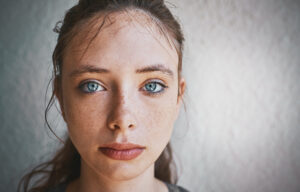 A young girl looking sad