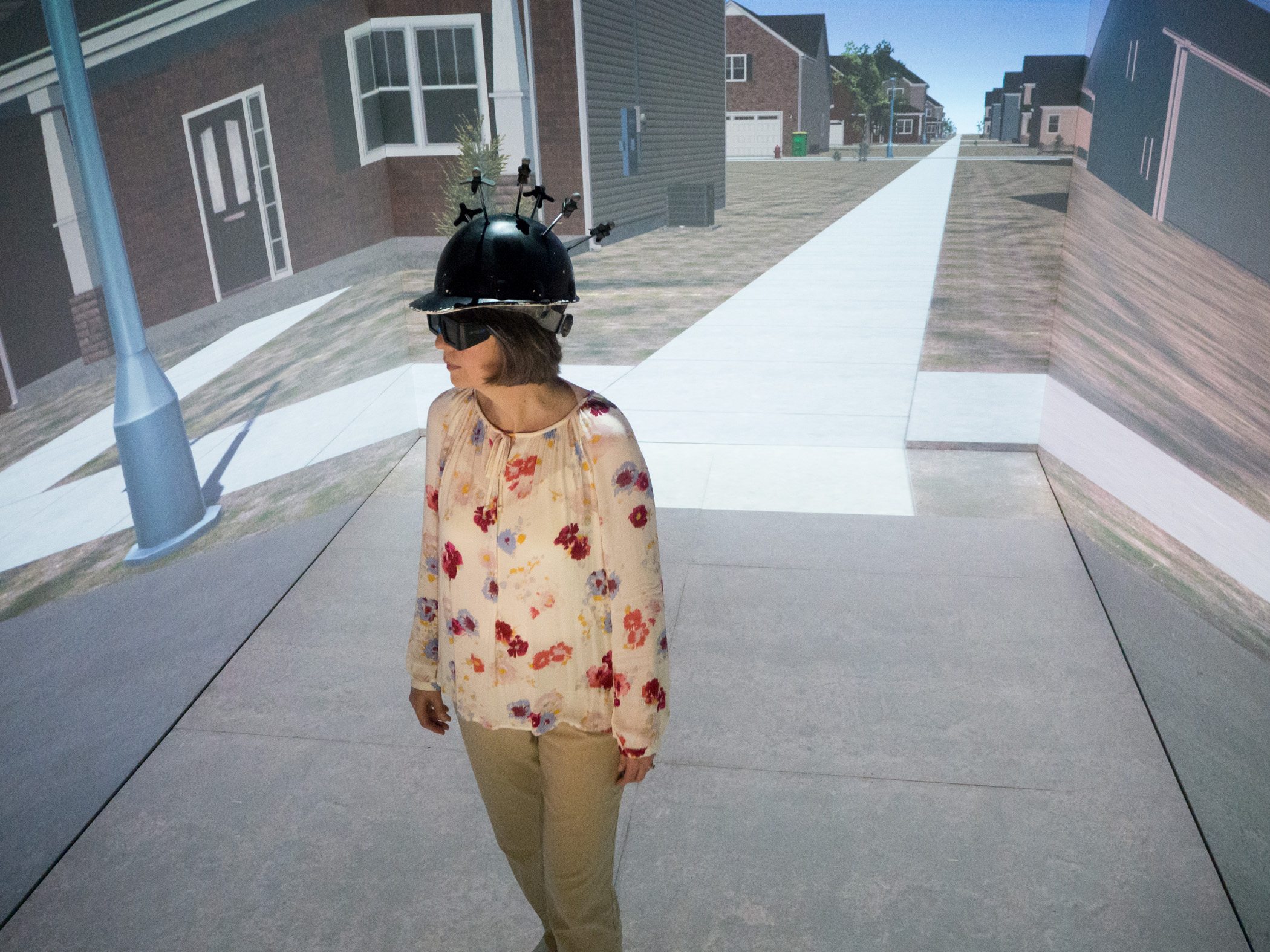 UI Professor Jodie Plumert demonstrates crossing a virtual road at the Hank Virtual Environments Labs at the University of Iowa.