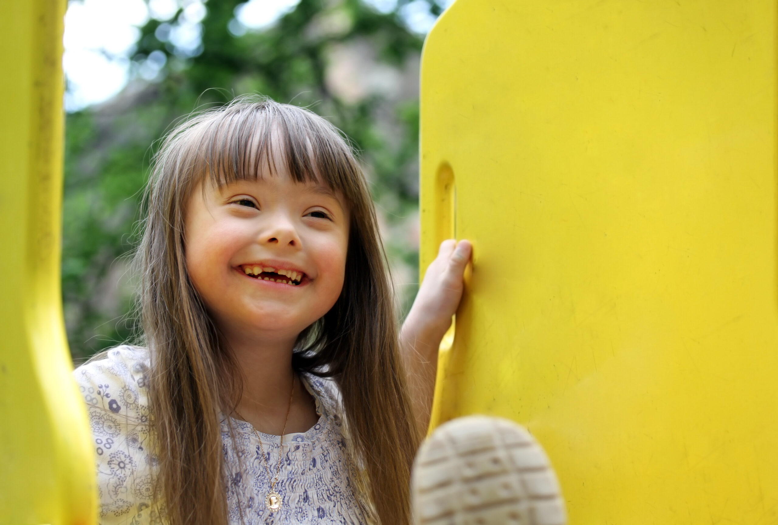 Portrait of beautiful young girl on the playground.