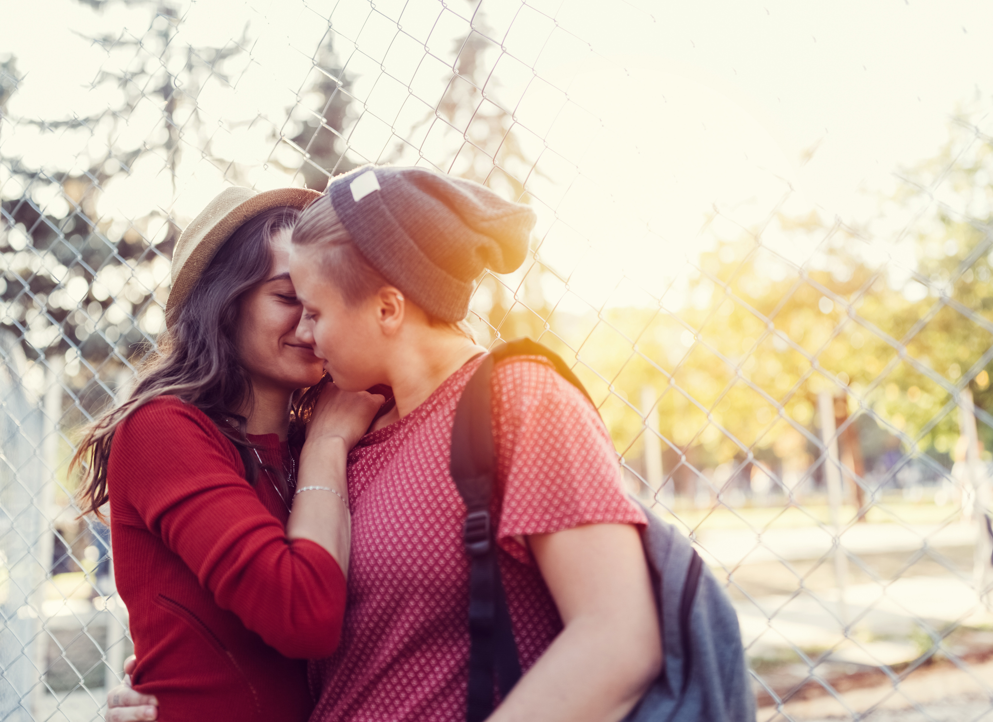LGBTQ couple kissing in the city park