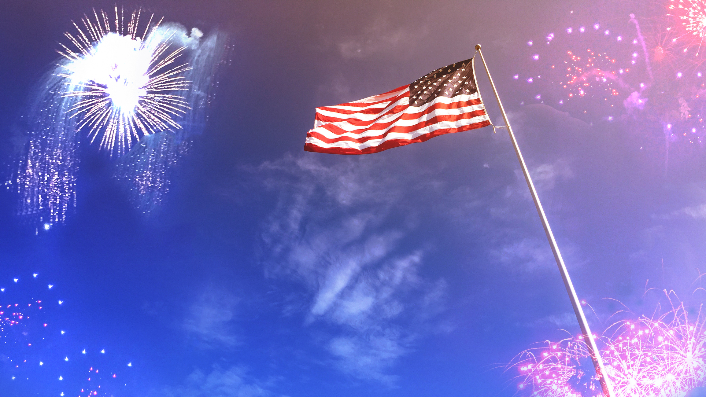 American Flag with Fireworks in Sky